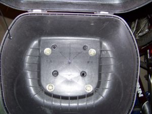 View of short bolts through the insides of the top case